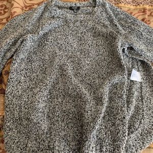 Long sleeve shirt, open on left side of shirt.